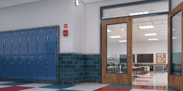 Image of an empty classroom from a hallway.