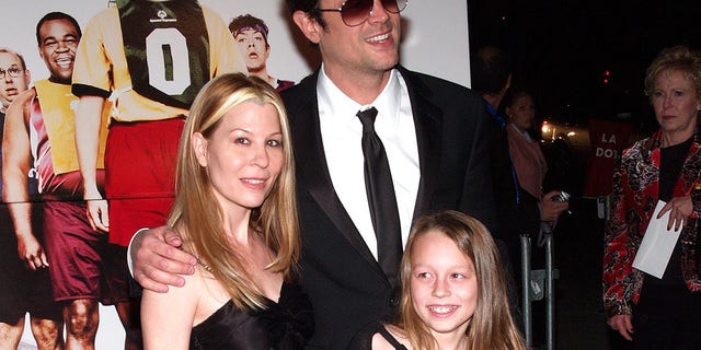 Melanie Clapp, Johnny Knoxville and their daughter at the 