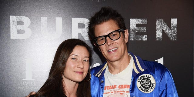 Actor Johnny Knoxville (R) and director Naomi Nelson arrive at the premiere of 
