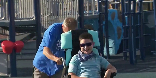 RBH Field of Dreams playground co-founder Christian Kane pushes his son Gavin's wheelchair at the Toms River, New Jersey, complex. (Fox News)