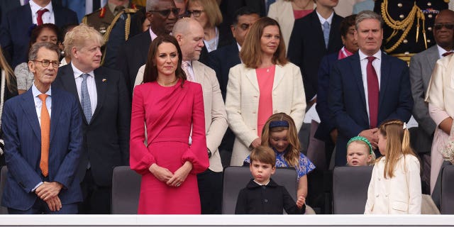 Britain's Catherine, Duchess of Cambridge, Prince Louis and British Prime Minister Boris Johnson attend the Platinum Jubilee pageant, marking the end of the celebrations for the Platinum Jubilee of Britain's Queen Elizabeth in London June 5, 2022.