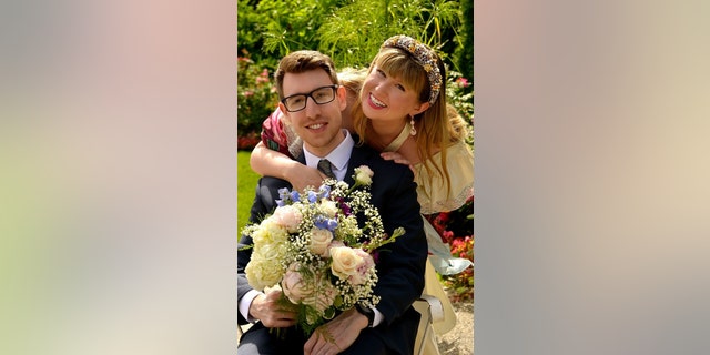 Katie and Kyle Boggemes on their wedding day at Venue One Eleven in Holly, Michigan, on June 25, 2022. 