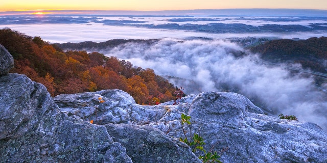 Sunrise at Pinnacle Overlook amid the fog in Cumberland Gap National Historic Park, which lies along Kentucky, Tennessee and Virginia.