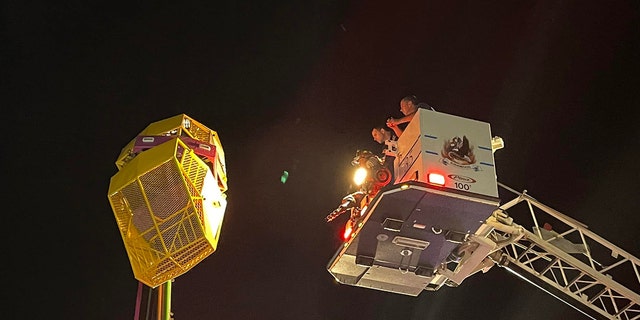 Some riders were stuck about 40 feet above the ground, rescue officials said.