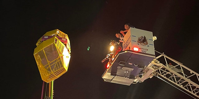 Some riders were stuck about 40 feet above the ground, rescue officials said.