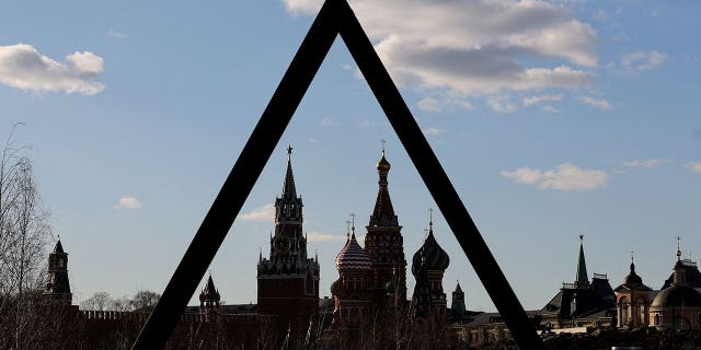 Kremlin's Spasskaya Tower and St. Basil's Cathedral are seen through objects in Zaryadye Park on March 15, 2022 in Moscow, Russia.  (Reuters/Evgenia Novozhenina/File Photo)