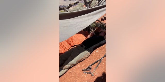 A hiker who took ill recently in the Grand Canyon is shown lying down here.