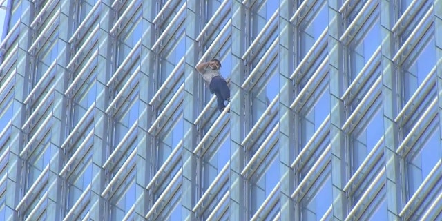 Man climbs Devon Tower  in Oklahoma City as part of pro-life protest.