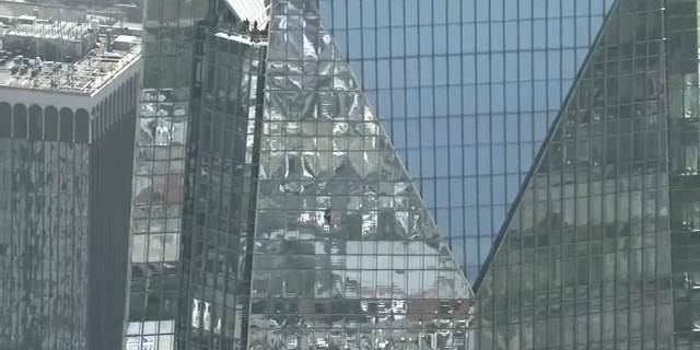 Devon Tower climber nears the top of 844-foot tall skyscraper in Oklahoma City. 