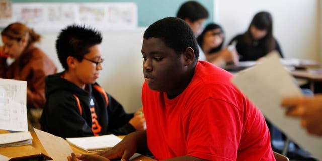 Devon Cunningham, 15, looks over his progress report during an Algebra 2 summer school class, part of the San Francisco Unified School District credit recovery program, at Lowell High School on Wednesday, June 27, 2012 in San Francisco, Calif. 