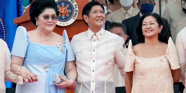 President Ferdinand Marcos Jr. stands with his mother Imelda Marcos, left, and his wife Maria Louise Marcos, right, during the inauguration ceremony at National Museum on Thursday, June 30, 2022 in Manila, Philippines. Marcos was sworn in as the country's 17th president.