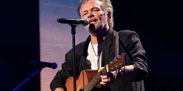 John Mellencamp slammed politicians' gun control efforts after the Uvalde school massacre. The musician is seen performing at Farm Aid 2021 at the Xfinity Theatre in Hartford, Conn. 