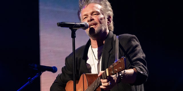 John Mellencamp slammed politicians gun law control efforts following the amss shooting at Robb Elementary in Uvalde, Texas. The musician is pictured here performing in concert during Farm Aid 2021 at the Xfinity Theatre in Hartford, Connecticut.