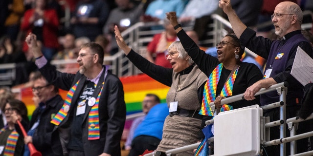 Protesters chant during the United Methodist Church's special session of the general conference in St. Louis Feb. 26, 2019. 