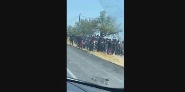 Hundreds of migrants suspected to have entered the country illegally were seen this week wandering the side of a highway in Eagle Pass, Texas. 