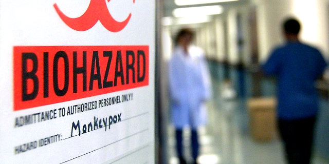 A warning sign on the door of the lab where the first step is taken in the testing of samples for monkeypox at the University of Minnesota's Veterinary Diagnostic Laboratory.
