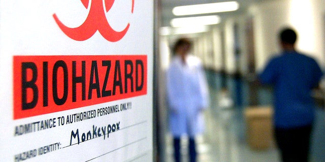 At the University of Minnesota's Veterinary Diagnostic Laboratory, the door to the lab where the first step is taken in the testing of samples for the monkeypox virus has a warning sign to let others know not to enter. Inside, the scientist wears a protective clothing. After the samples leave this room for further testing of the DNA, they are no longer infectious. -- GENERAL INFORMATION: 7/31/03- Falcon Heights, MN - The University of Minnesota's Veterinary Disease Control Laboratory has been chosen by the Center For Disease Control as the national testing site to screen for the monkeypox virus in animals.