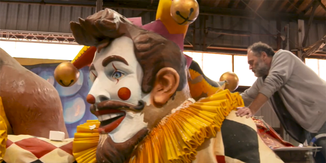 A New Orleans artist paints a Mardi Gras parade float on an episode of Fox Nation's "Hidden Gems." (Fox Nation)