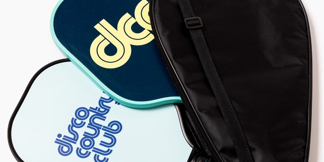 A pickleball set with two paddles, a case, and a set of three balls is shown here.