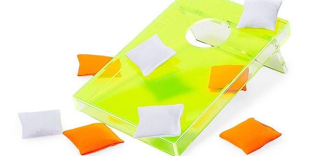 This acrylic cornhole set includes one game board and eight bean bags. 