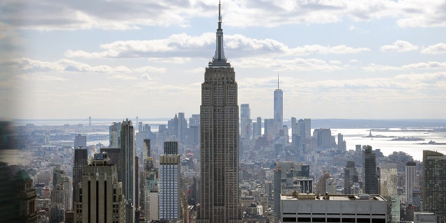 The Empire State Building towers above other largely empty office buildings on March 4, 2021, in New York City.