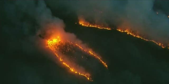 A wildfire burning through Wharton State Forest in New Jersey was 45% contained as of Monday morning, officials said.
