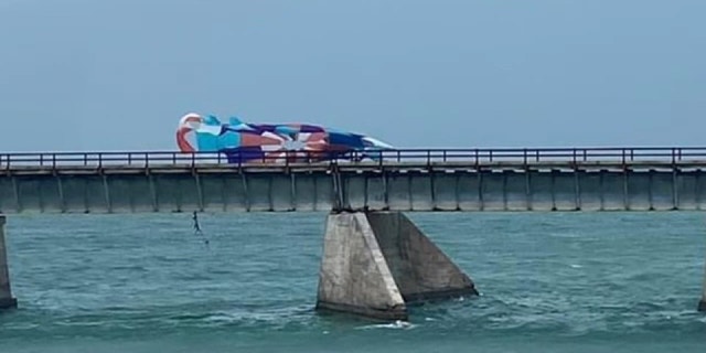 A woman died and her son and nephew sustained injuries following a parasailing accident in the Florida Keys on Memorial Day.