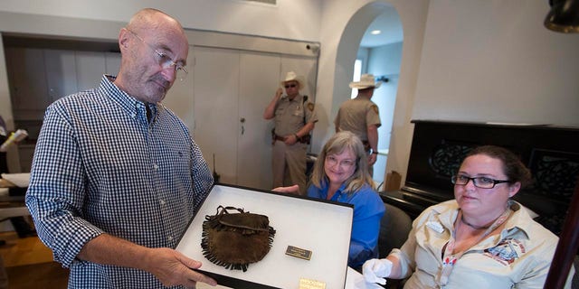 British music legend Phil Collins donates what is considered the biggest collection of Alamo artifacts to the people of Texas. 