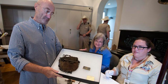 British music legend Phil Collins donates what is considered the biggest collection of Alamo artifacts to the people of Texas. 