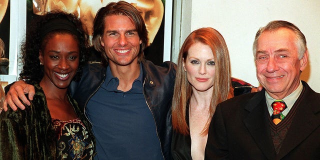 April Grace, actor Tom Cruise, actress Julianne Moore, and actor Philip Baker Hall. The film is directed by Paul Thomas Anderson and also stars Julianne Moore.