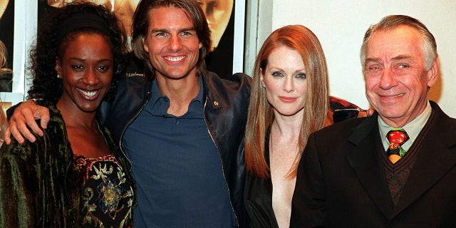 April Grace, actor Tom Cruise, actress Julianne Moore, and actor Philip Baker Hall. The film is directed by Paul Thomas Anderson and also stars Julianne Moore.