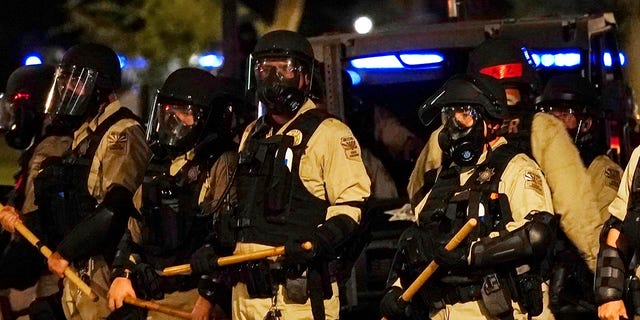 Police in riot gear surround the Arizona Capitol after protesters reached the front of the Arizona Sentate building as protesters reacted to the Supreme Court decision to overturn the landmark Roe v. Wade abortion decision Friday, June 24, 2022, in Phoenix. (G3 Box News Photo/Ross D. Franklin)