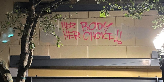 Rioters tagged a pro-choice message on a building in downtown Portland while marching through the city on June 25. 