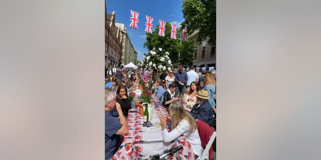 Members of the public celebrate Queen Elizabeth II's Platinum Jubilee in London. 