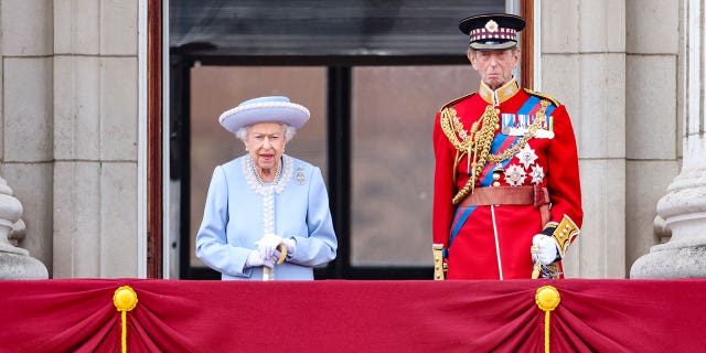 Queen Elizabeth and Prince Edward, Duke of Kent, stand on the balcony of the Buckingham Palace during the Trooping the Colour parade in celebration of the queen's Platinum Jubilee.