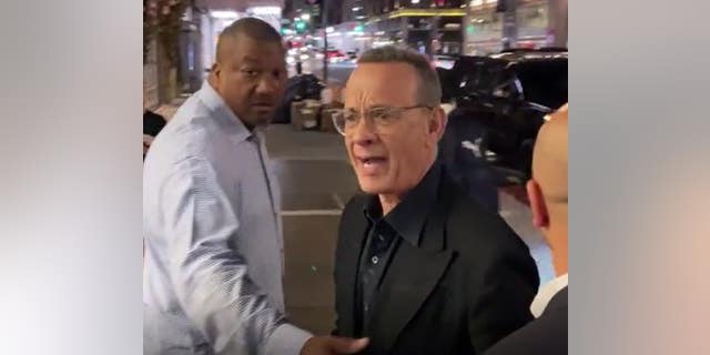 Tom Hanks defended wife Rita Wilson after fans came too close for comfort while they were leaving dinner Wednesday.
