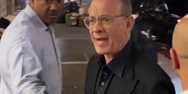 Tom Hanks defended wife Rita Wilson after fans came too close for comfort while they were leaving dinner Wednesday.