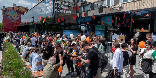 People line up to visit a newly-opened fast-food restaurant in a former McDonald's outlet on Bolshaya Bronnaya Street in Moscow Sunday, June 12, 2022. 