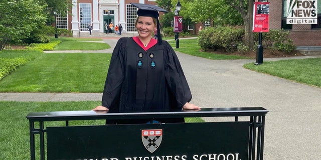 Shelane Etchison in her graduation robes after completing two master's programs at Harvard University.