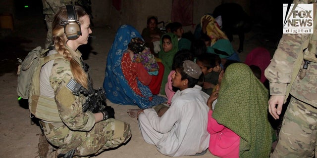 Shelane Etchison gathers information about the Taliban from women and children in the Helmand Province.
