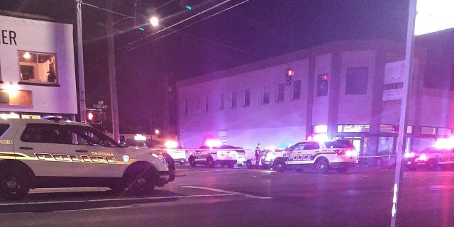 The shooting unfolded early Sunday in an alley behind a private venue that was hosting a rave for a large crowd in Tacoma, Washington, police said.