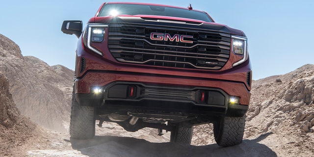 The 2022 GMC Sierra AT4X shows off its front fascia on the trail.