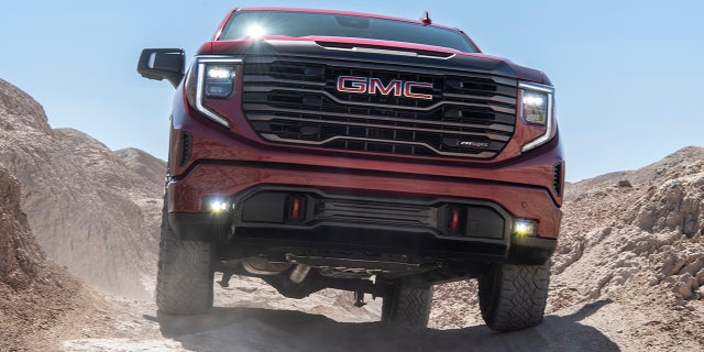 The 2022 GMC Sierra AT4X shows off its front fascia on the trail.