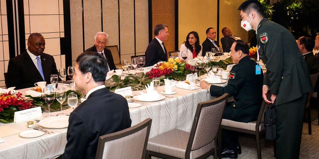 China's Defense Minister, Gen. Wei Fenghe, center right, talks with United States Secretary of Defense, Lloyd Austin, left, during the 19th International Institute for Strategic Studies (IISS) Shangri-la Dialogue, Asia's premier defense forum, in Singapore, Saturday, June 11, 2022. 