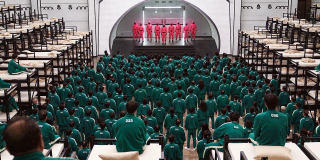 This image released by Netflix shows a scene from the popular Korean series "Squid Game." Netflix announced "Squid Game: The Challenge," a reality competition show, based on the series.