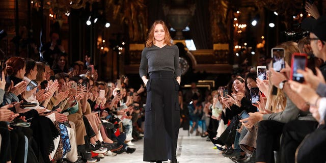 Designer Stella McCartney accepts applause at the conclusion of her ready to wear Fall-Winter 2019-2020 collection, that was presented in Paris, March 4, 2019.