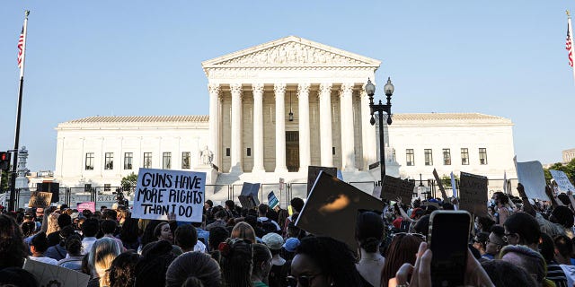 Abortion rights demonstrators gather outside the US Supreme Court in Washington, D.C., US, on Friday, June 24, 2022. A deeply divided Supreme Court overturned the 1973 Roe v. Wade decision and wiped out the constitutional right to abortion, issuing a historic ruling likely to render the procedure largely illegal in half the country. Photographer: Valerie Plesch/Bloomberg via Getty Images