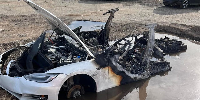 Firefighters made a pit for the Tesla and filled it with water to extinguish the flames.