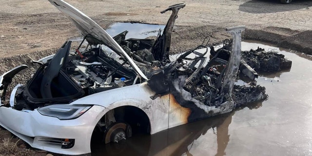 Firefighters made a pit for the Tesla and filled it with water to extinguish the flames.