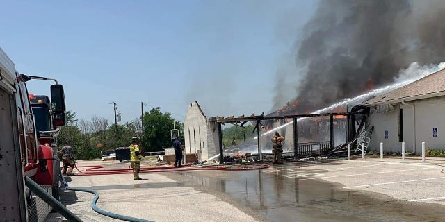 Firefighters worked to extinguish the fire that broke out at the Balsora Baptist Church in Bridgeport, Texas on Friday.